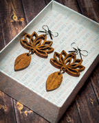 Layered wooden lotus flower earrings with silver bow stud tops displayed in a premium white Slate & Ember jewelry gift box.